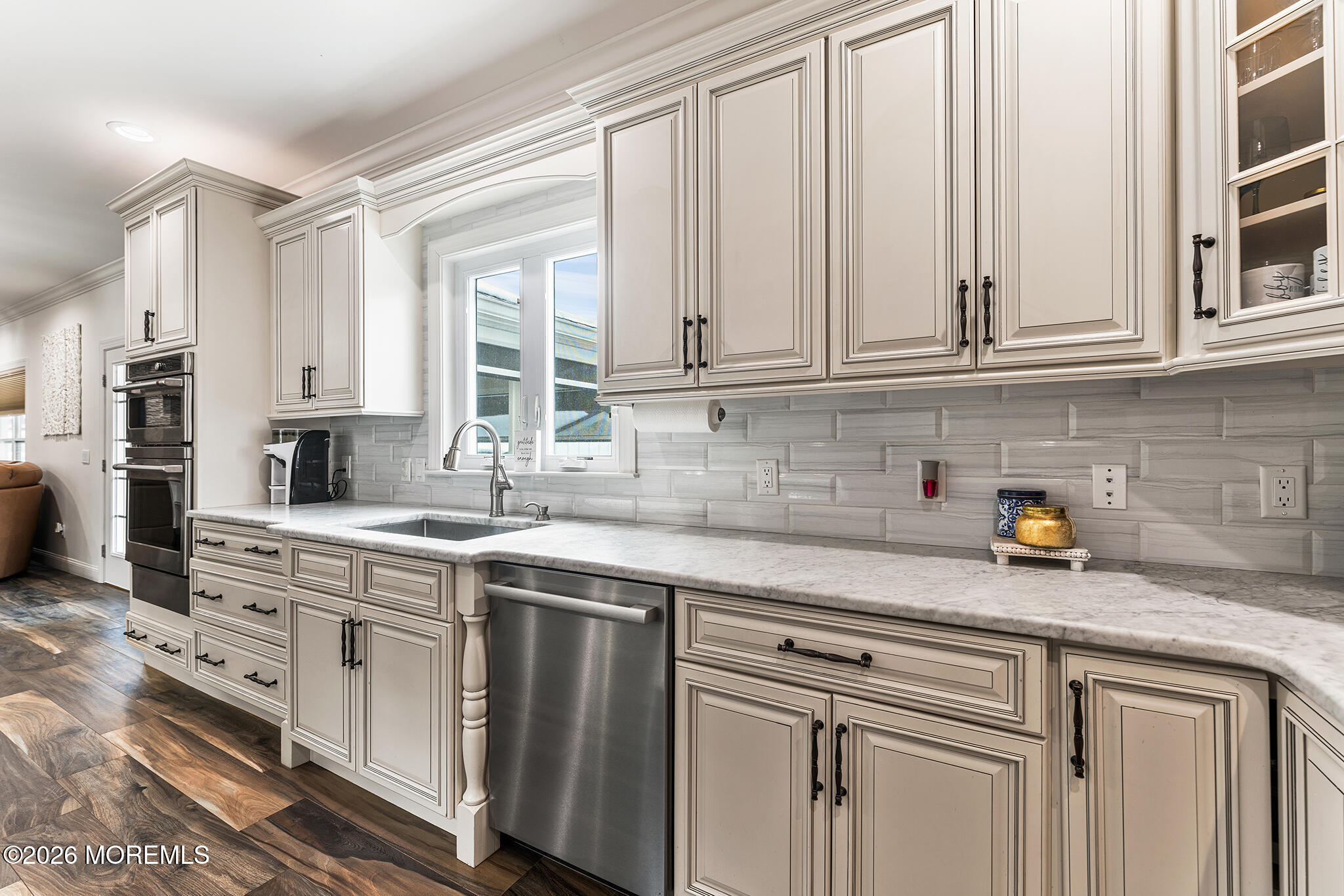 8 Cindy Court Howell, NJ 07731 - Photo 29 of 63 a kitchen with stainless steel appliances granite countertop a sink and cabinets with wooden floor