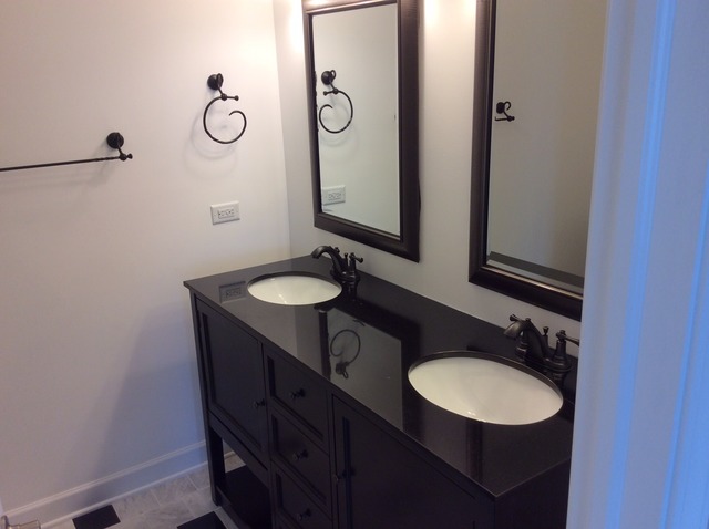 305 Shoreline Road, Unit 305 Lake Barrington, IL 60010 - Photo 15 of 23 a bathroom with a sink and a mirror