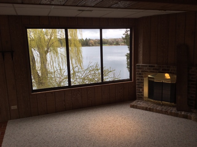 305 Shoreline Road, Unit 305 Lake Barrington, IL 60010 - Photo 20 of 23 wooden floor in an empty room with a window
