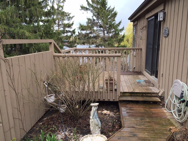 305 Shoreline Road, Unit 305 Lake Barrington, IL 60010 - Photo 23 of 23 a view of deck with wooden fence and floor