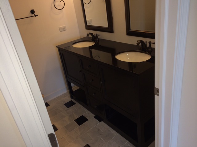 305 Shoreline Road, Unit 305 Lake Barrington, IL 60010 - Photo 5 of 23 a bathroom with a sink and a mirror