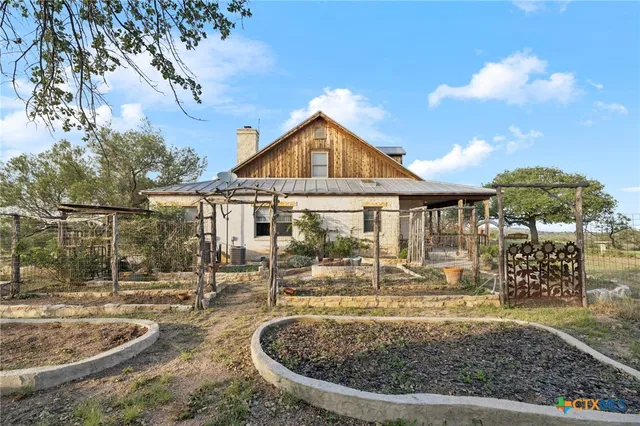 a kitchen with a table and chairs in it