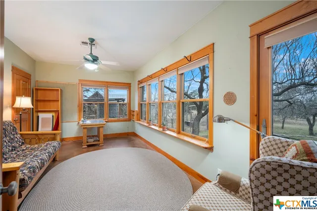 a bed room with a bed mirror and a window