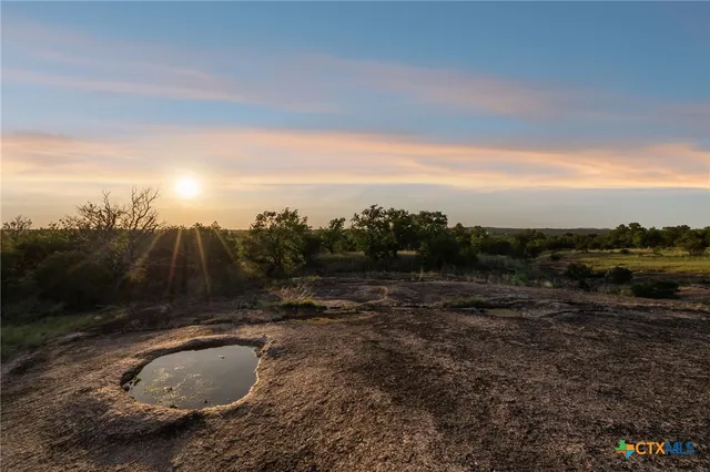 a view of a lake with a garden