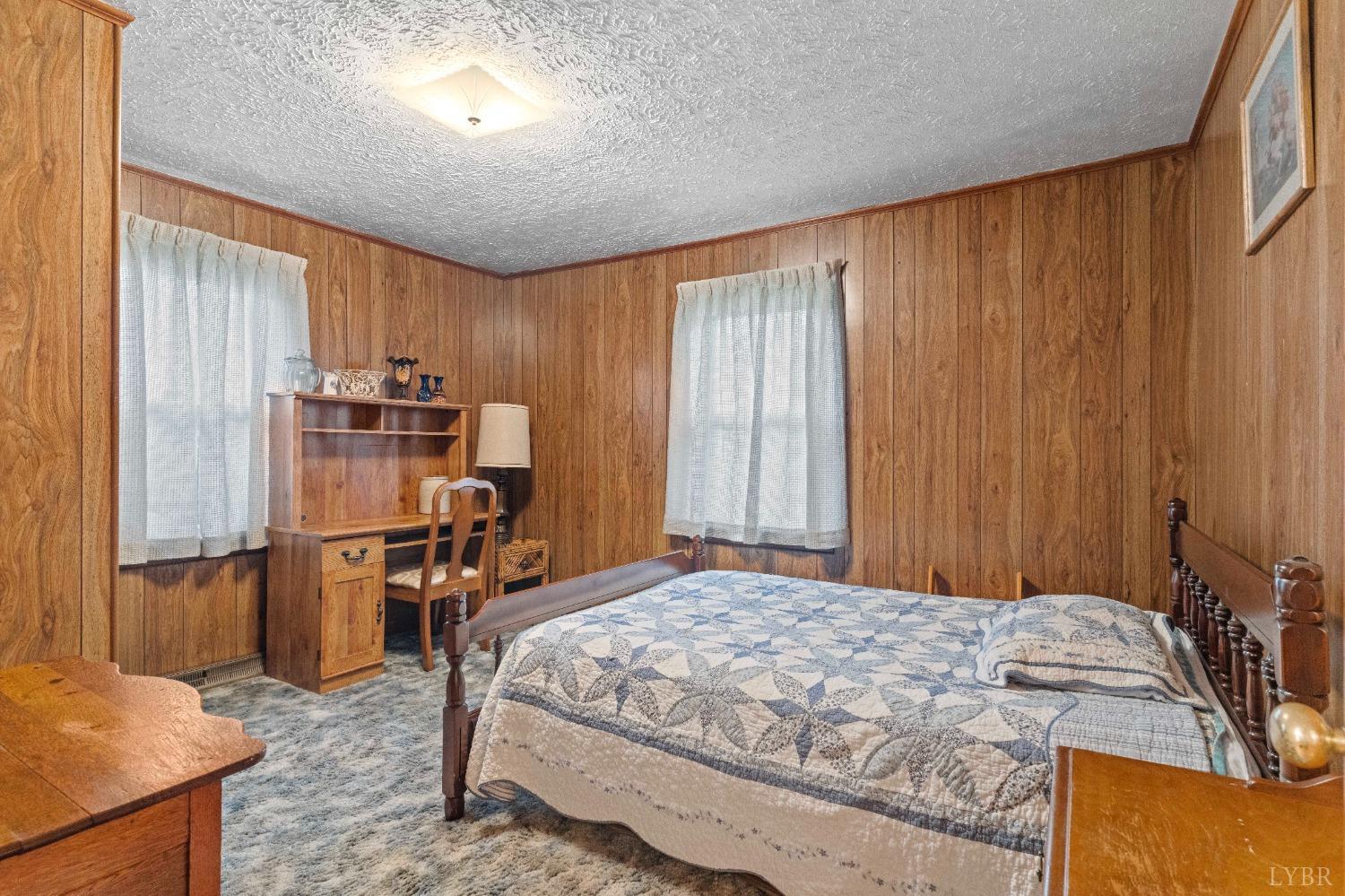 2550 Pamplin Road Pamplin, VA 23958 - Photo 19 of 35 a bedroom with a bed and a refrigerator