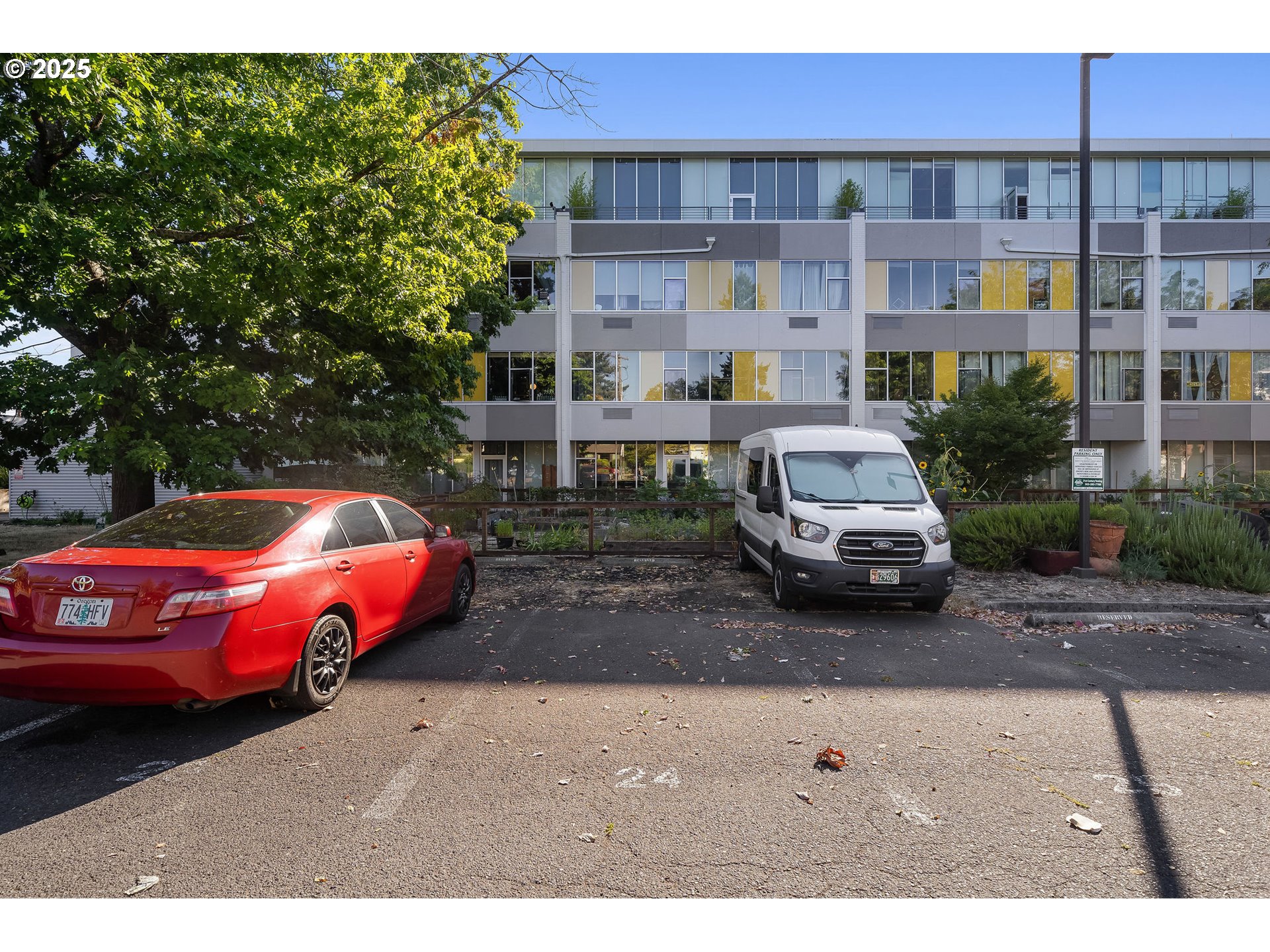 900 Northeast 81st Avenue, Unit 111 Portland, OR 97213 - Photo 20 of 25 a front view of a building with parking space