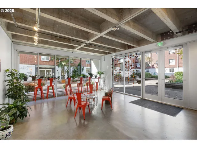 a view of a room with lots of wooden furniture
