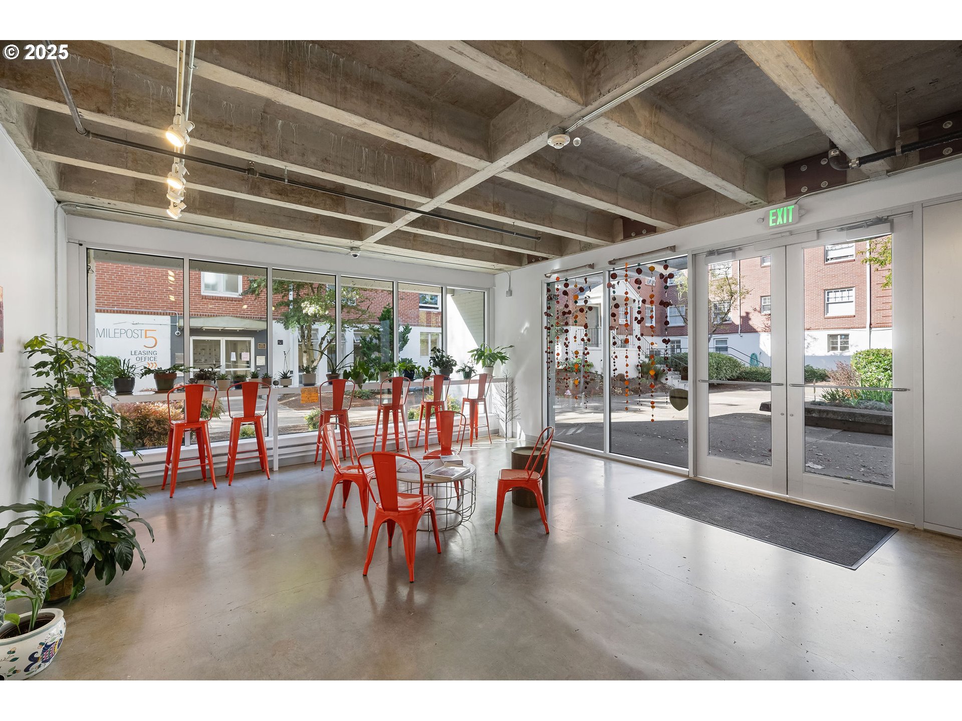 900 Northeast 81st Avenue, Unit 111 Portland, OR 97213 - Photo 2 of 25 a view of a room with lots of wooden furniture