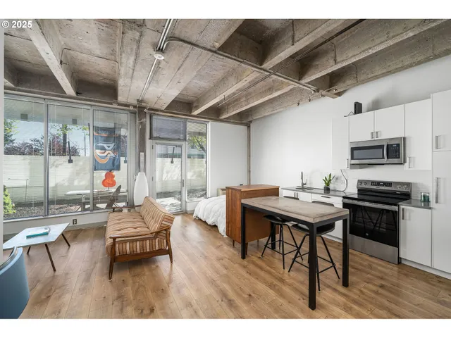 a dining room with furniture and wooden floor