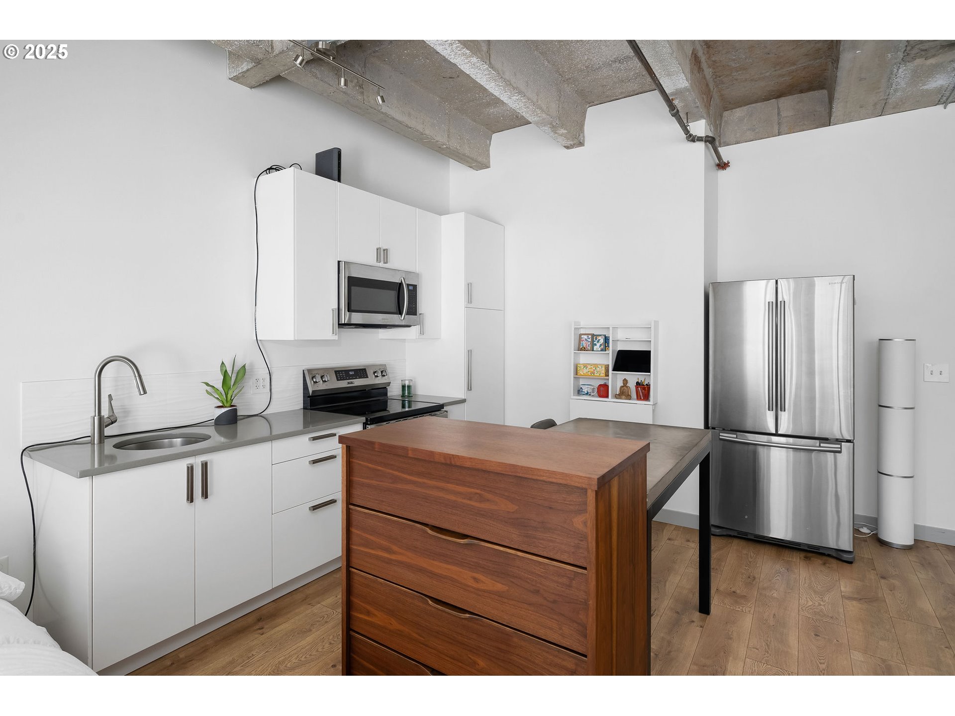 900 Northeast 81st Avenue, Unit 111 Portland, OR 97213 - Photo 8 of 25 a kitchen with a refrigerator and a sink