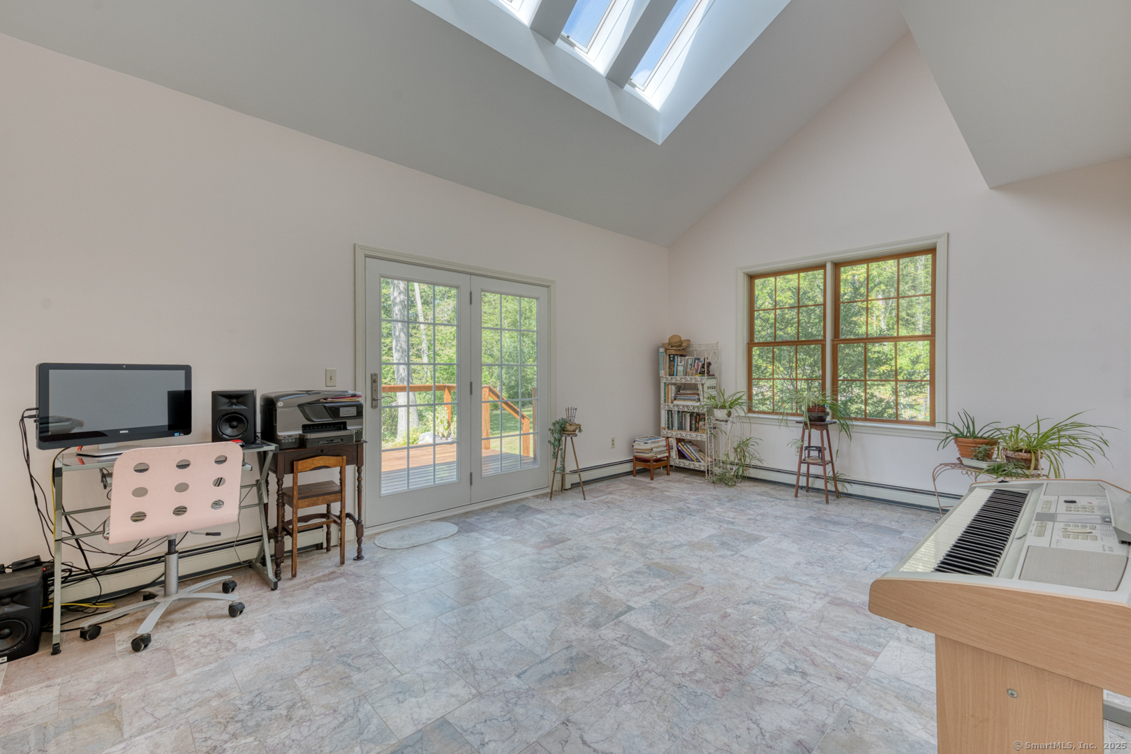287 South Bear Hill Road Chaplin, CT 06235 - Photo 19 of 40 a view of a livingroom with workspace and a window