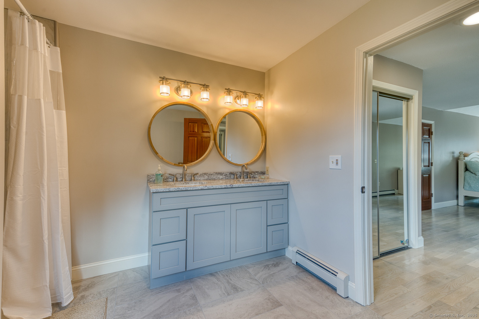 287 South Bear Hill Road Chaplin, CT 06235 - Photo 23 of 40 a bathroom with a sink and a mirror