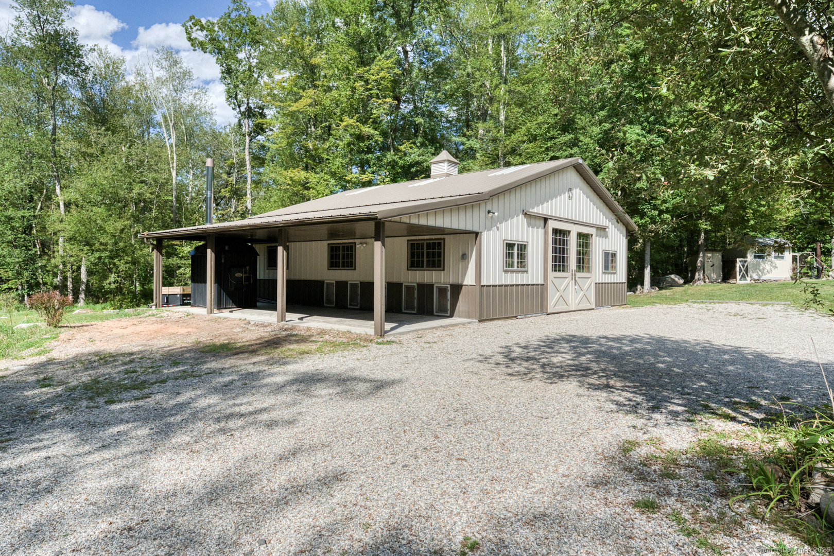 287 South Bear Hill Road Chaplin, CT 06235 - Photo 31 of 40 a front view of a house with a garden
