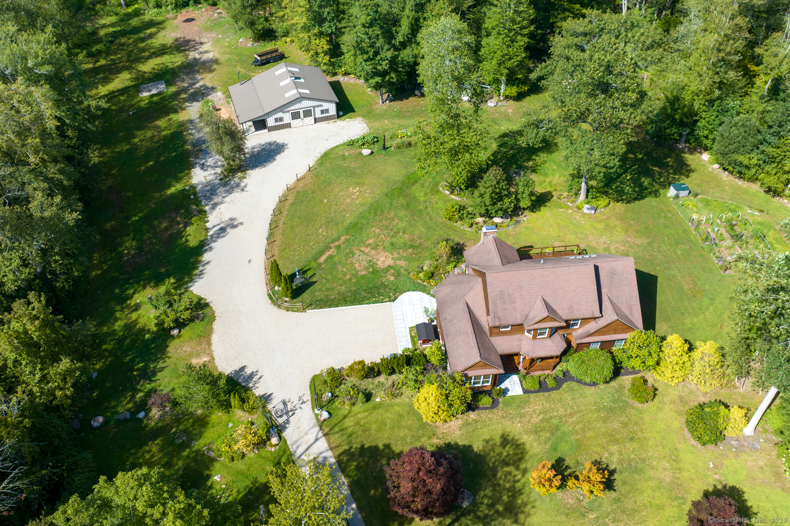 287 South Bear Hill Road Chaplin, CT 06235 - Photo 38 of 40 an aerial view of a swimming pool with outdoor space and trees all around