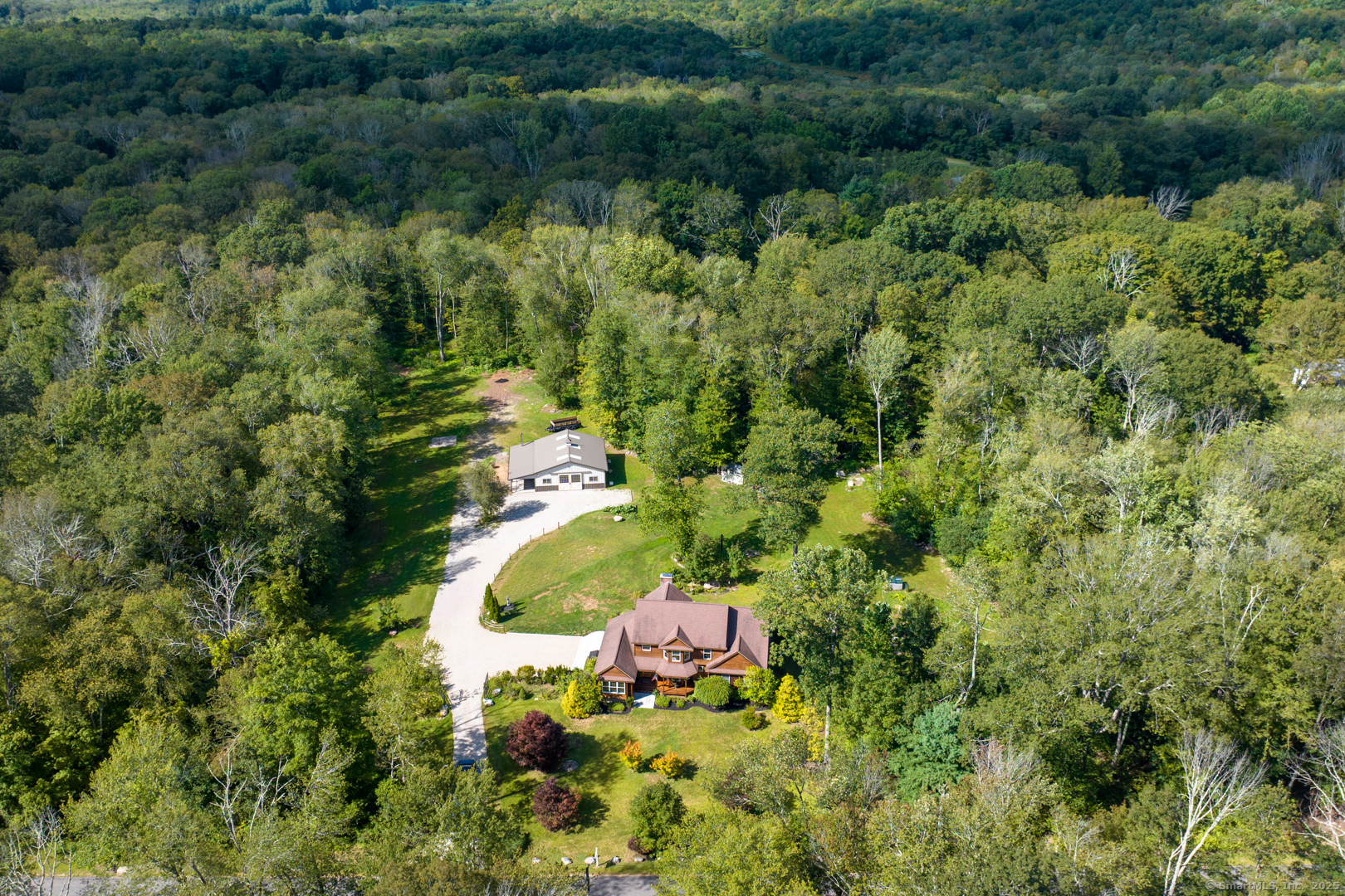 287 South Bear Hill Road Chaplin, CT 06235 - Photo 39 of 40 an aerial view of a house with a yard and trees