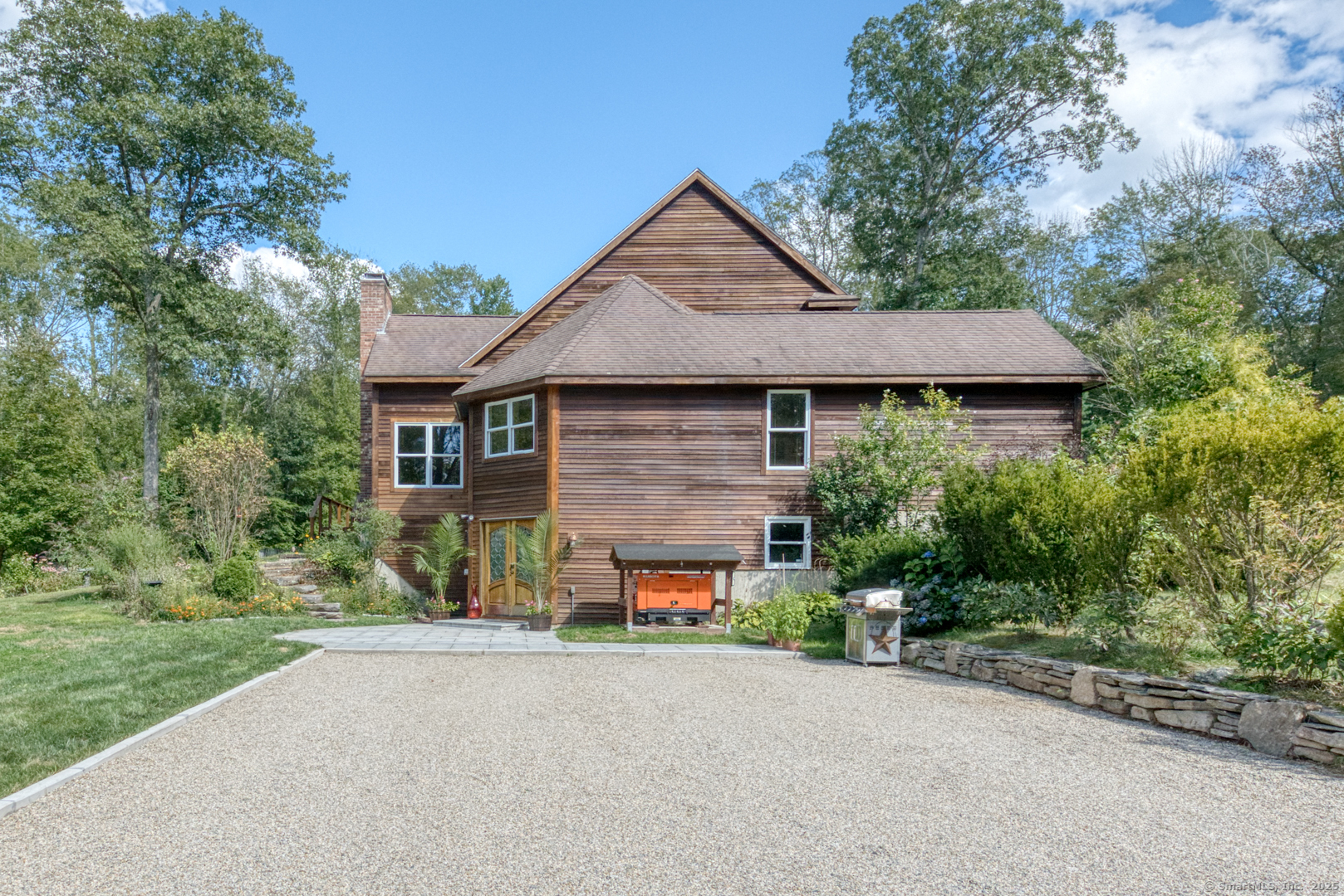 287 South Bear Hill Road Chaplin, CT 06235 - Photo 5 of 40 a front view of a house with a yard and garage
