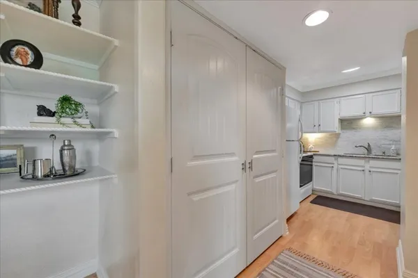 a kitchen with a sink and cabinets