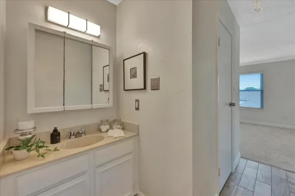 a bathroom with a sink and mirror