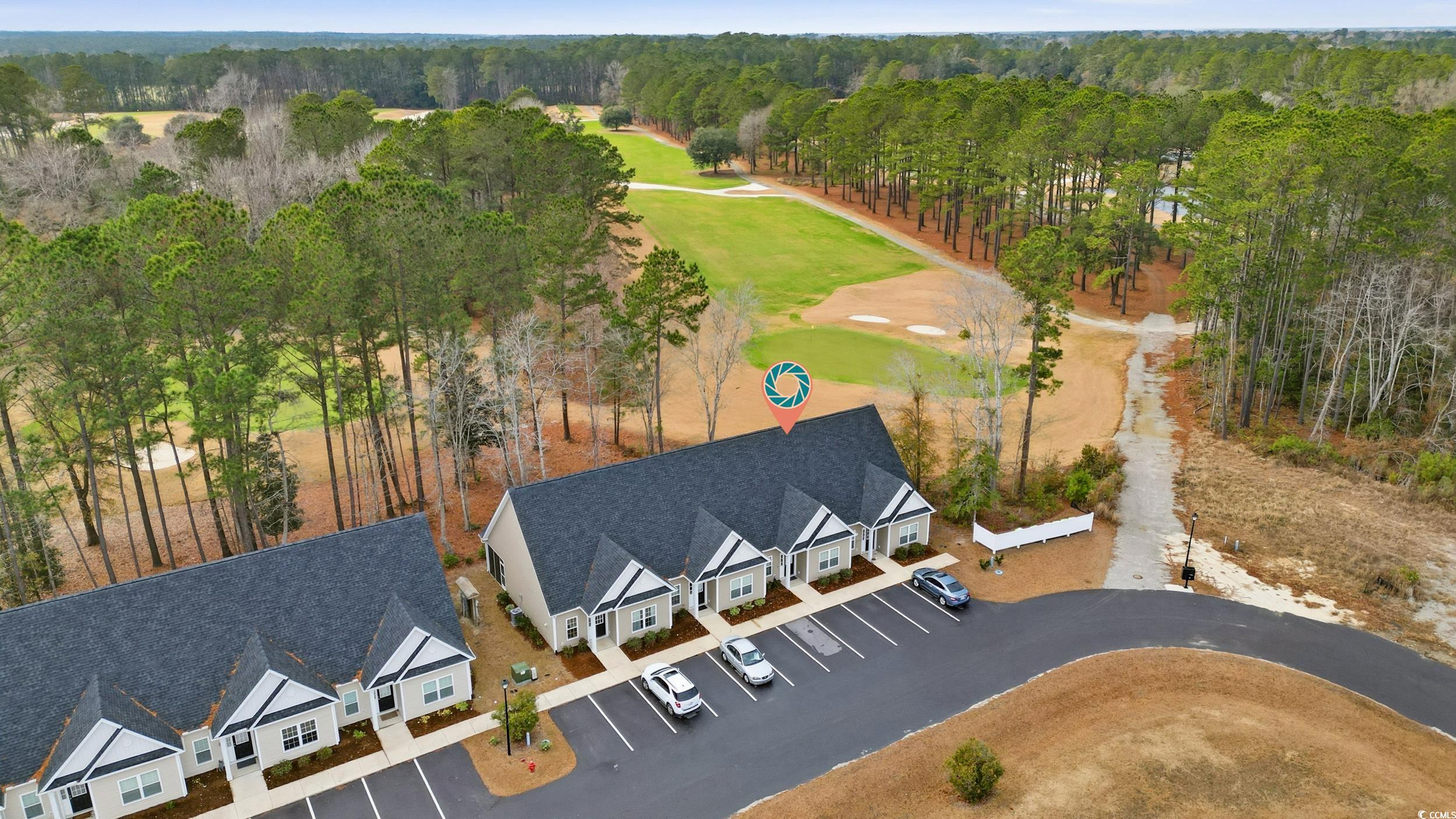 116 Kingsbury Loop, Unit C Conway, SC 29526 - Photo 28 of 32 Drone / aerial view of a local golf course and a heavily wooded area
