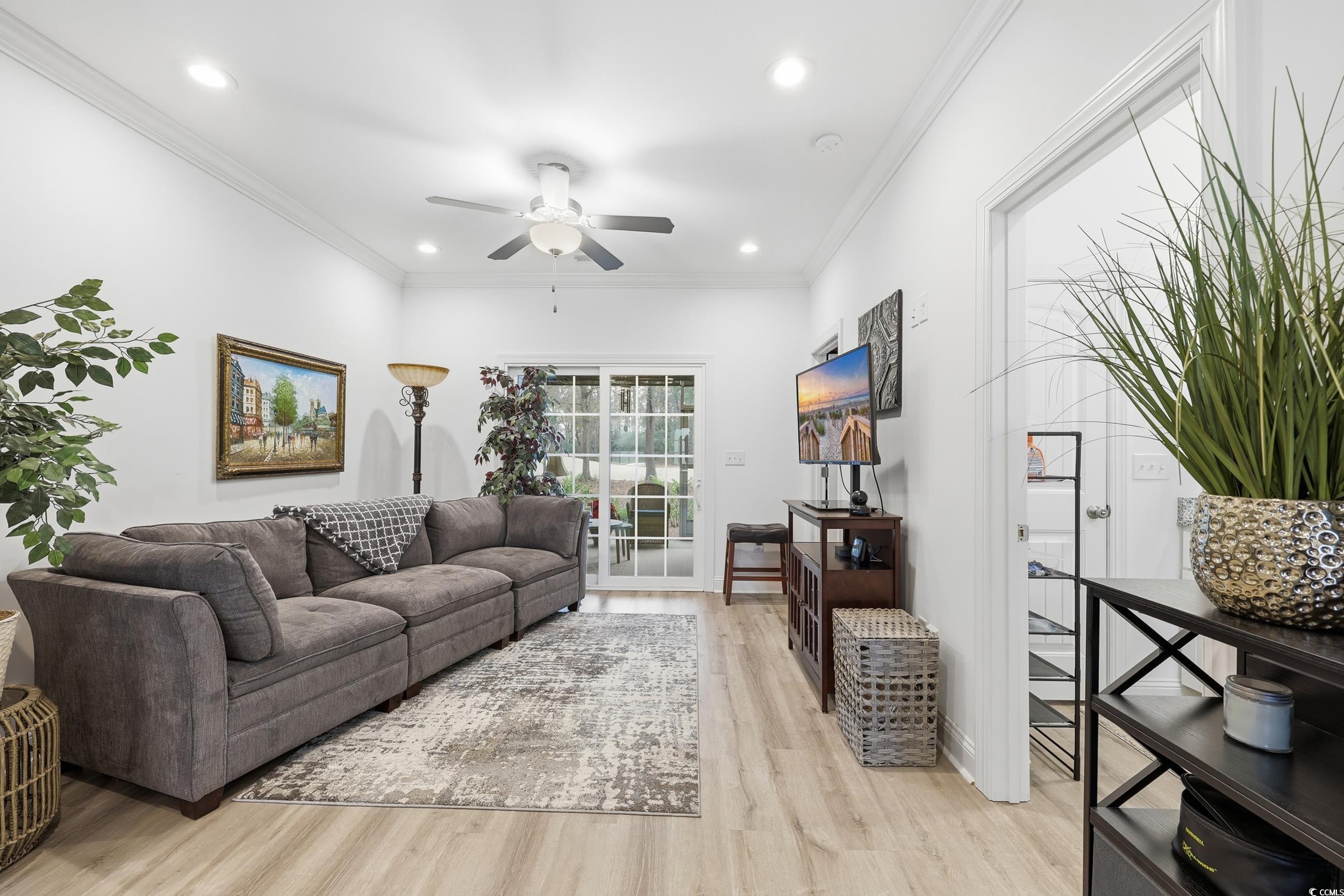 116 Kingsbury Loop, Unit C Conway, SC 29526 - Photo 3 of 32 Living room featuring crown molding, lvp flooring, ceiling fan, and recessed lighting