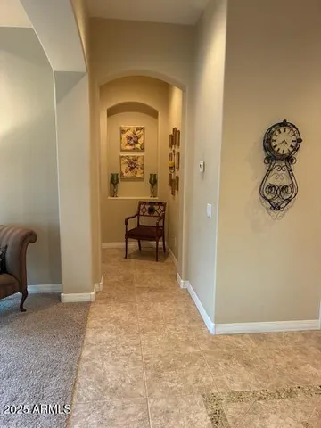 a white toilet sitting next to a bathroom sink and vanity