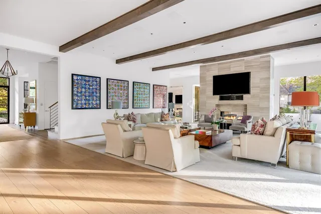 a living room with fireplace furniture and a flat screen tv