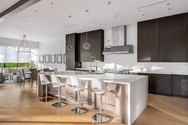 a kitchen with lots of counter top space and dining table