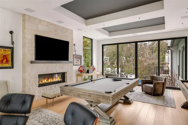 a living room with furniture fireplace and a flat screen tv