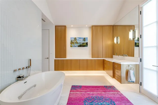 a bathroom with a bathtub and a sink