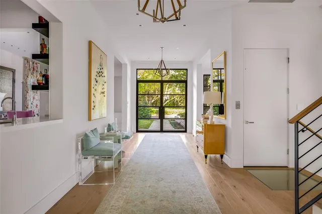 a spacious bedroom with a bed and a window