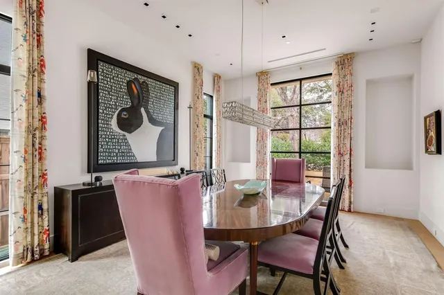 a dining room with furniture and window
