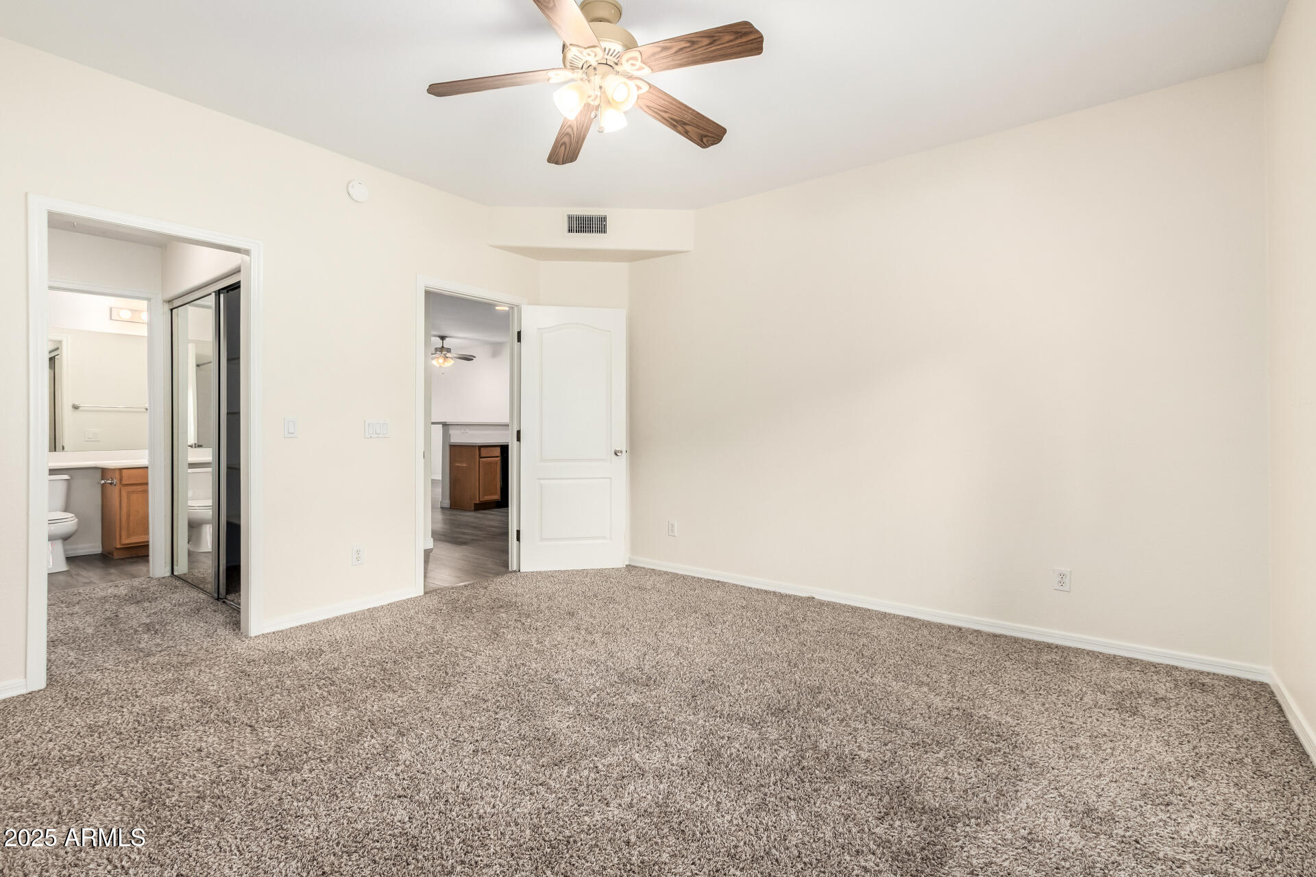 2201 North Comanche Drive, Unit 1104 Chandler, AZ 85224 - Photo 11 of 25 wooden floor in an empty room