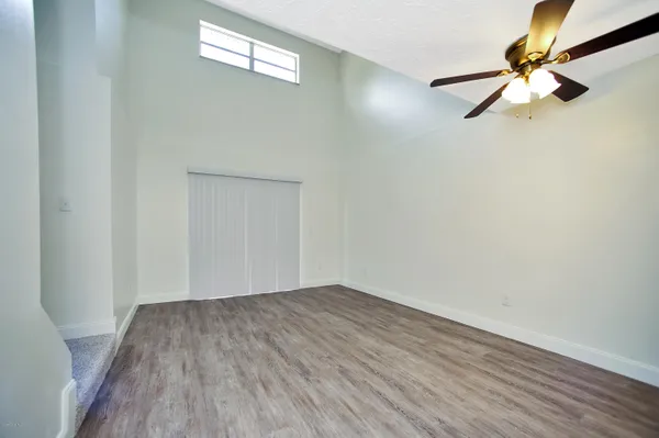 a view of a room with wooden floor