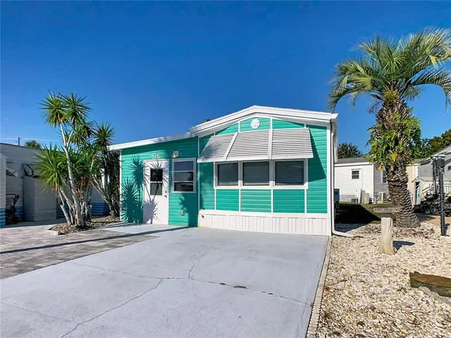 a view of a room that has a table and chair