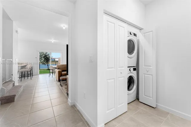 a view of a storage and utility room with washer and dryer
