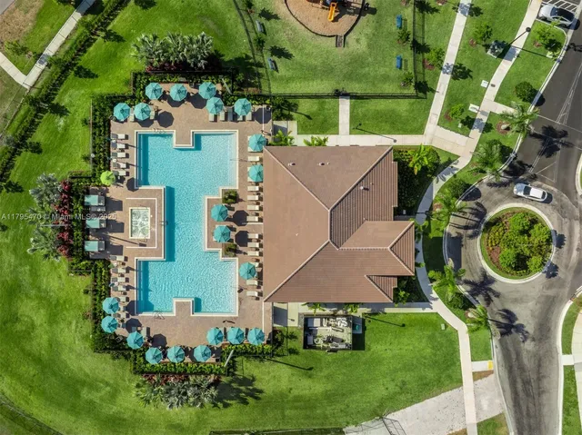 an aerial view of a house with garden space and street view