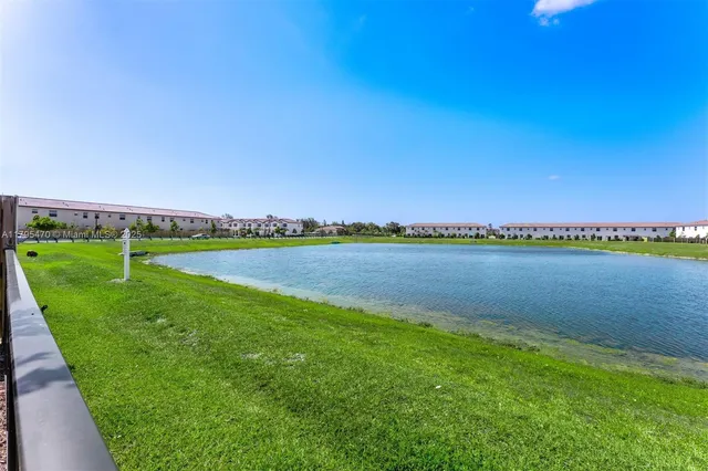 a view of a lake with a big yard
