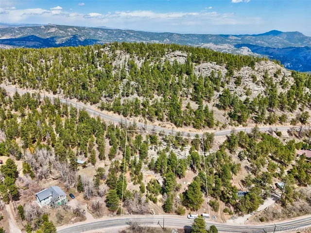 a view of a city with green field