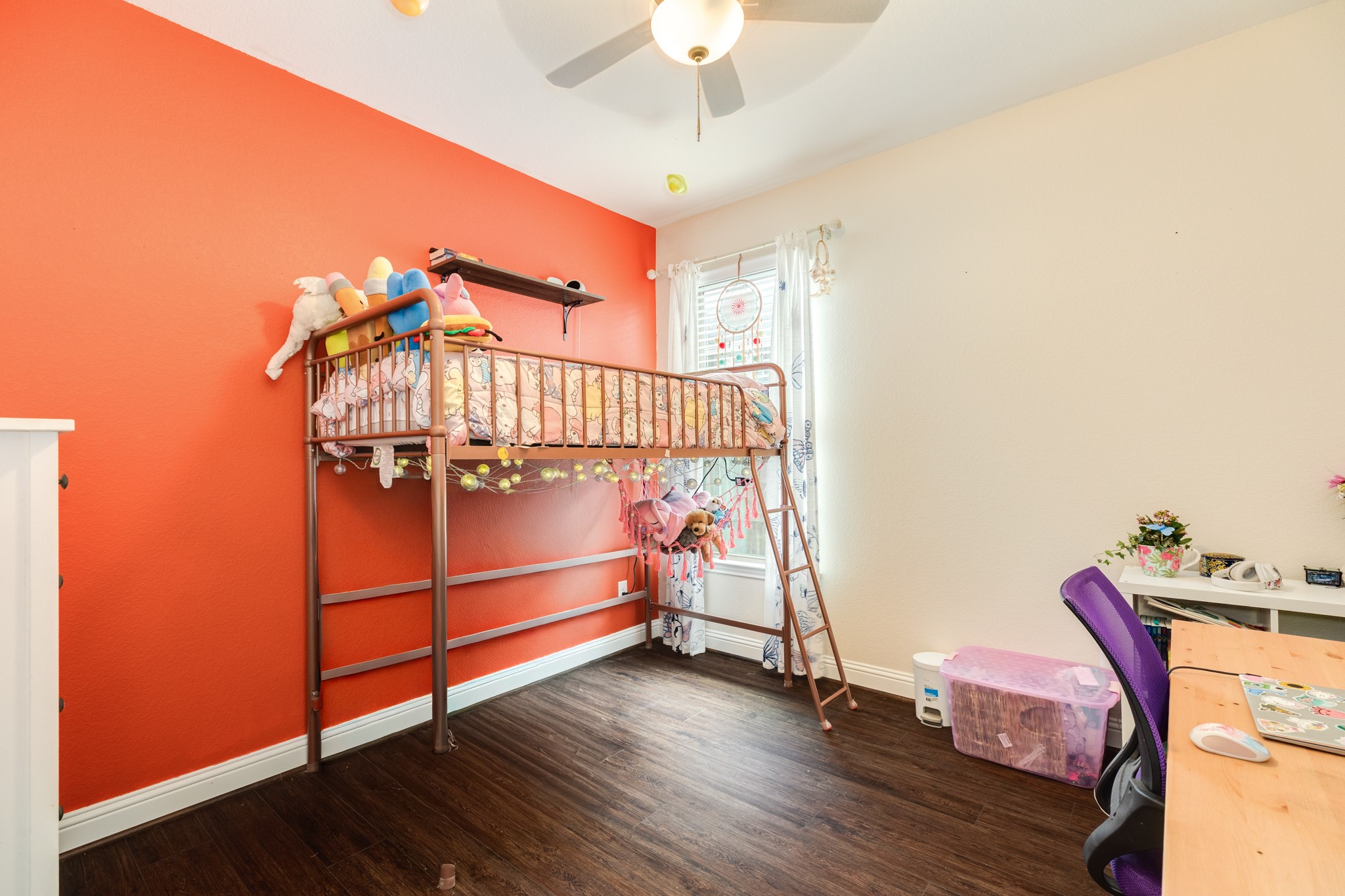 3519 Bay Drive Rosharon, TX 77583 - Photo 4 of 49 Spacious secondary bedroom featuring a modern ceiling fan, ample floor space, and an abundance of natural light streaming through the windows.
