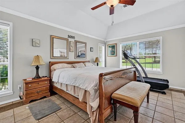 a bedroom with furniture and a window