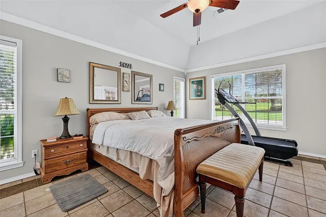 a bedroom with furniture and a window