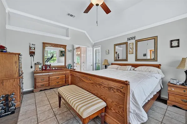 a bedroom with a bed and a dresser