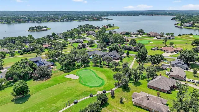 a view of a lake with a yard and lake view
