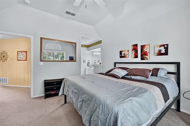 a bedroom with a bed and a desk