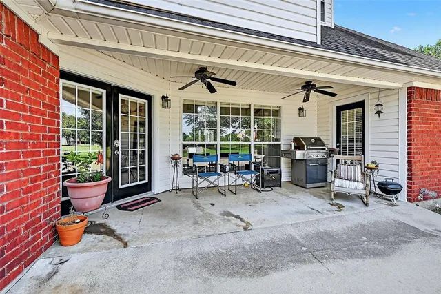 a view of a room with gym equipment and a potted plant