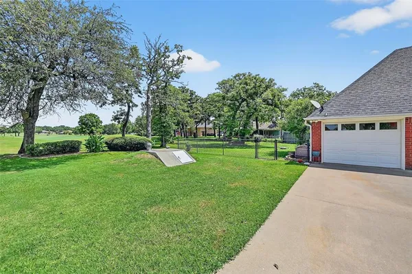 a view of a house with a big yard