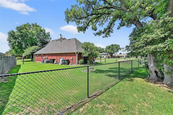 a view of house with a yard