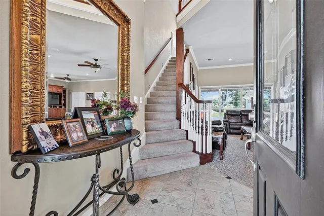 a view of living room kitchen and entryway
