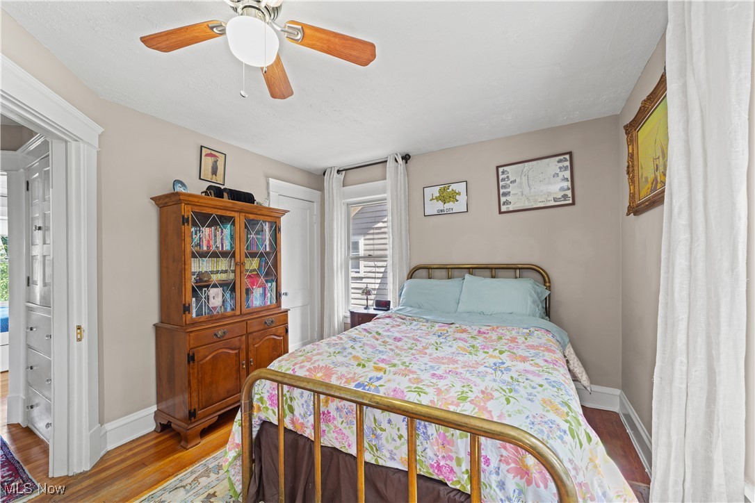 3024 Somerton Road Cleveland, OH 44118 - Photo 22 of 39 Bedroom with light wood-style floors and a ceiling fan