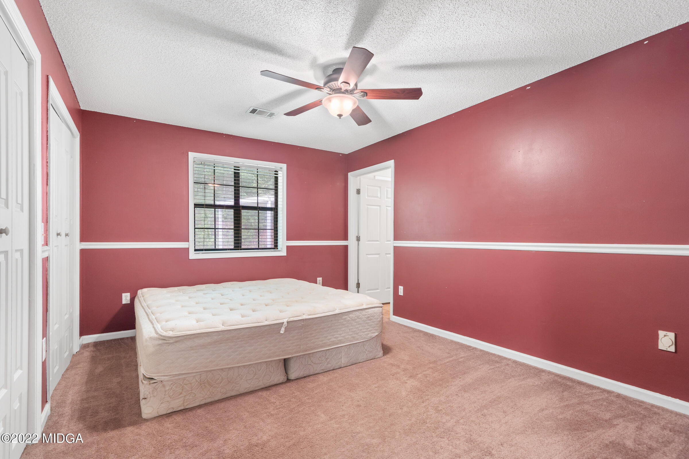457 Lite-N-Tie Road Gray, GA 31032 - Photo 11 of 30 a bedroom with a bed and window